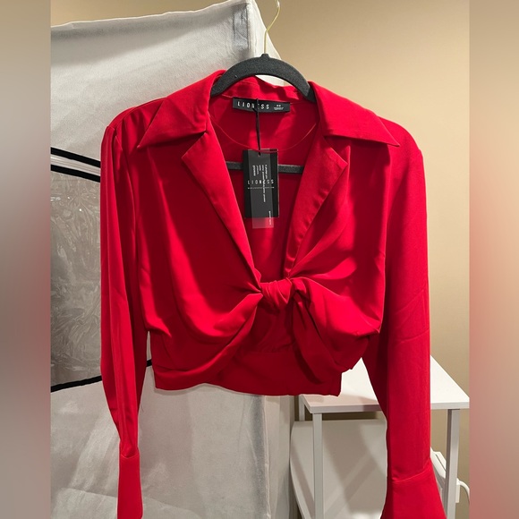 Lioness Tops - Red Xs going out top. Runs a little bigger fits like a small. New, never worn.